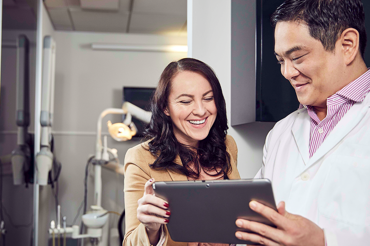 Dentist consulting patient 1200x800.png