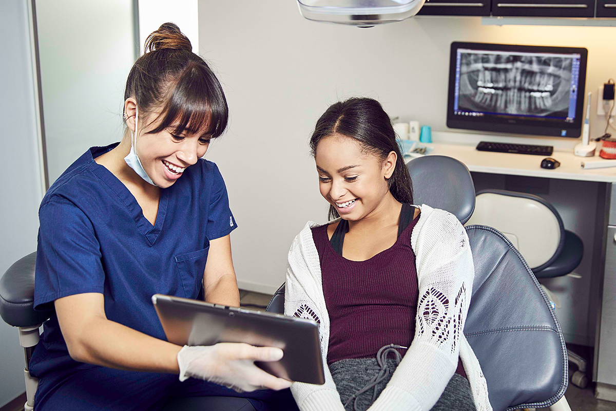 Dentist talking with patient 1200x800.png