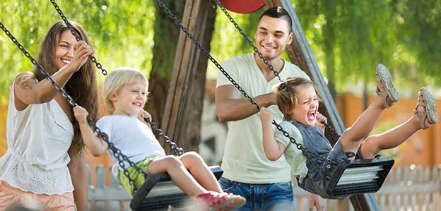 Couple swinging two kids - 624x299.jpg